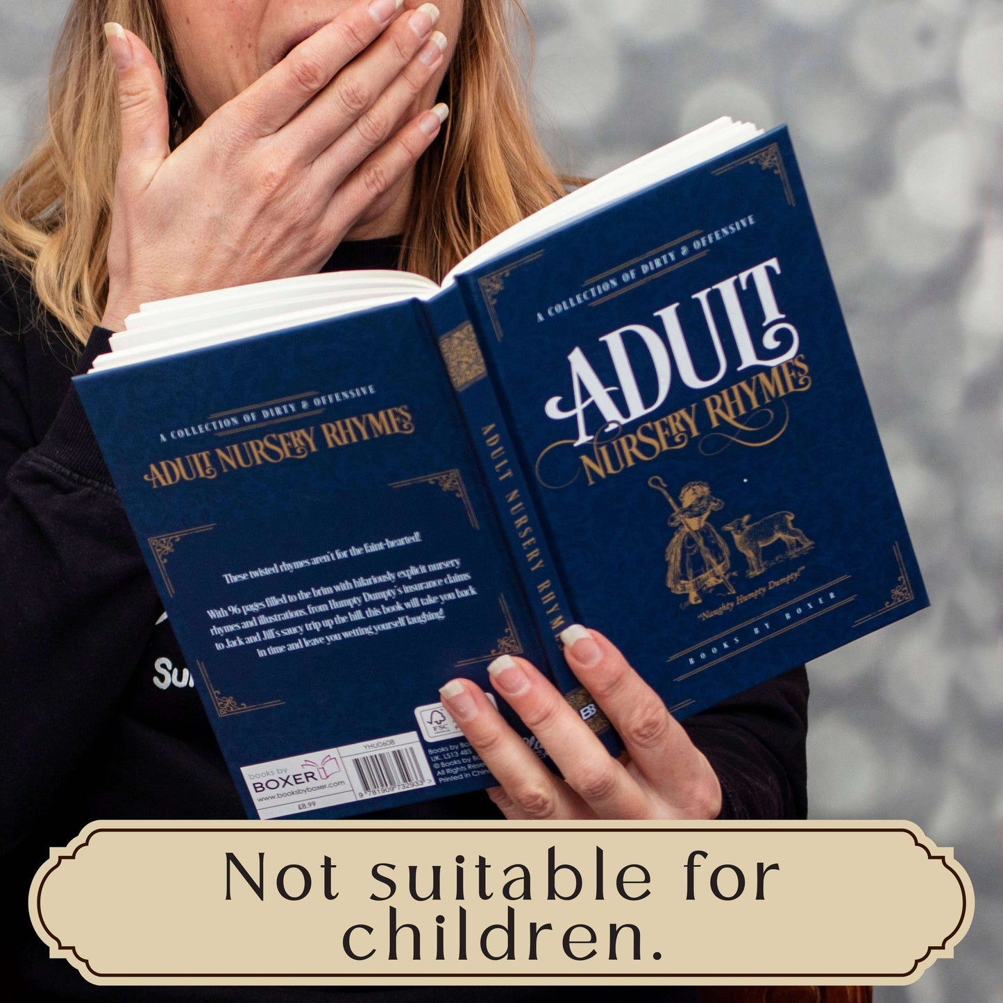 Book titled 'Adult Nursery Rhymes' held open by a person with a warning label at the bottom.