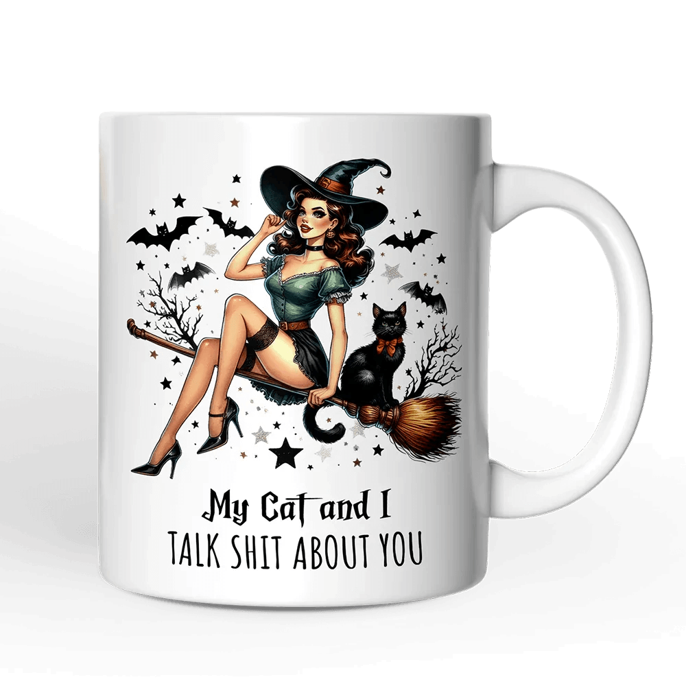 White mug with a witch and cat design and text on a black background