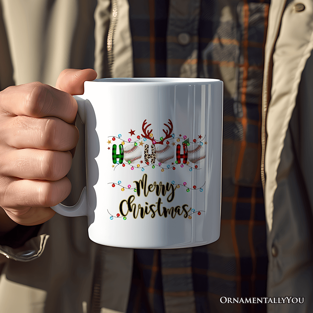 Person holding a white mug with Christmas design and text.