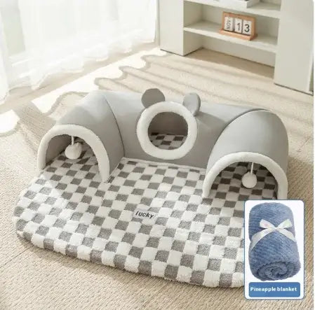 Gray pet playpen with checkered blanket on a light wooden floor