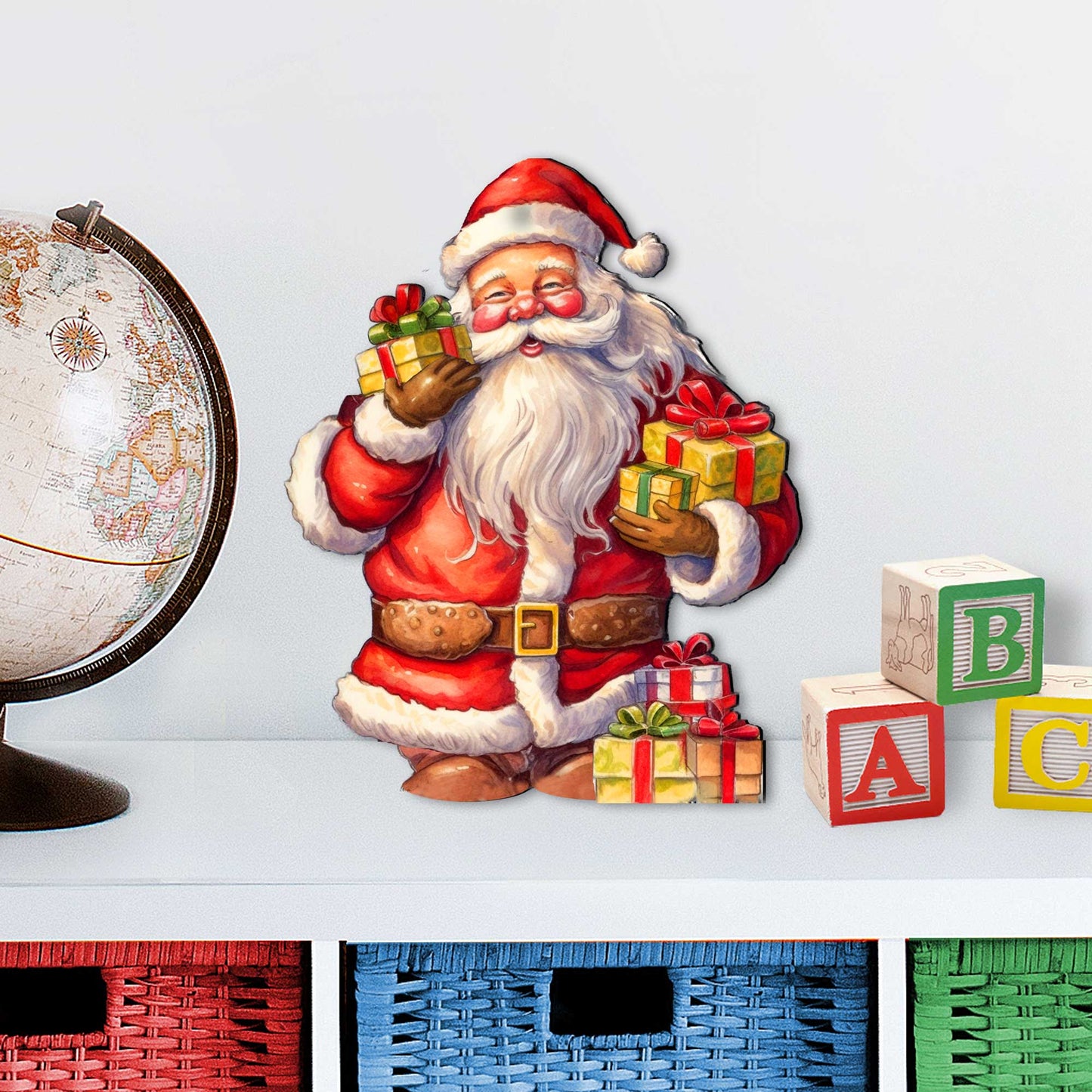 Illustration of Santa Claus with gifts next to a globe and children's blocks on a light gray background