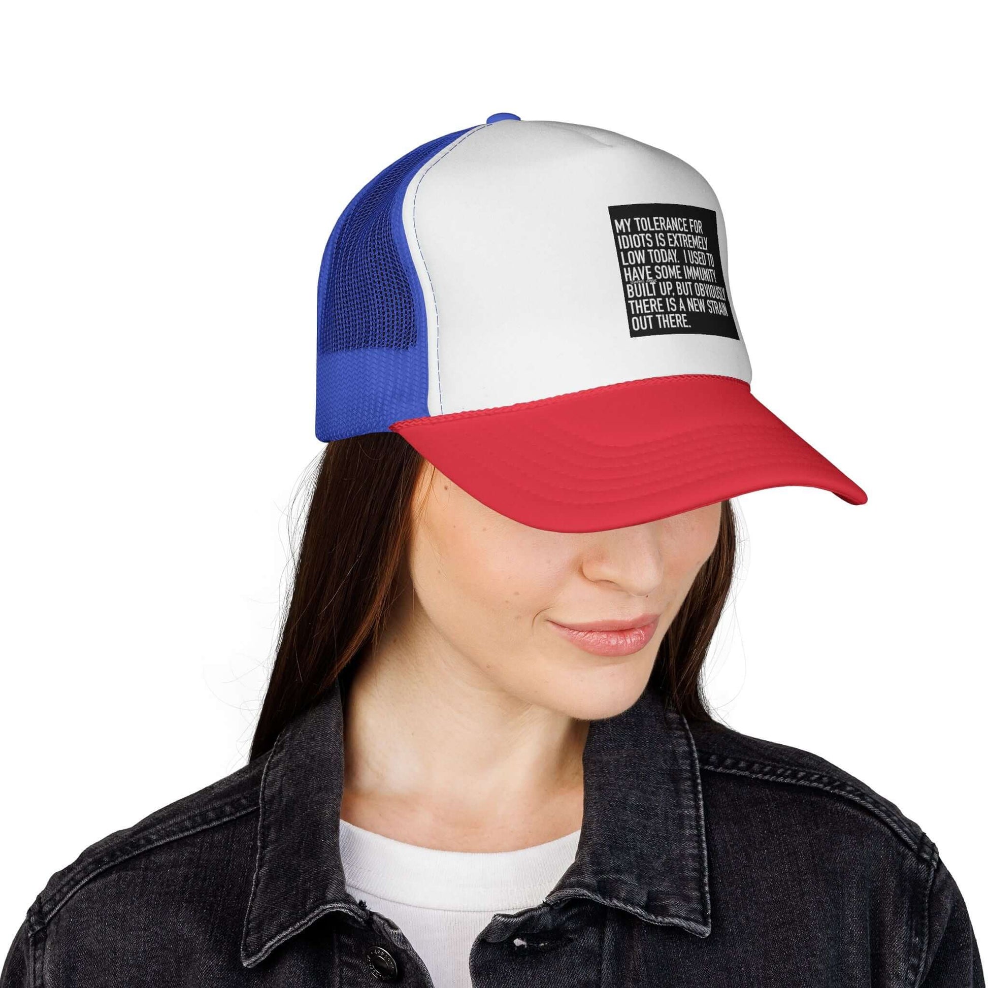 Person wearing a blue and red cap with a white front panel on a white background
