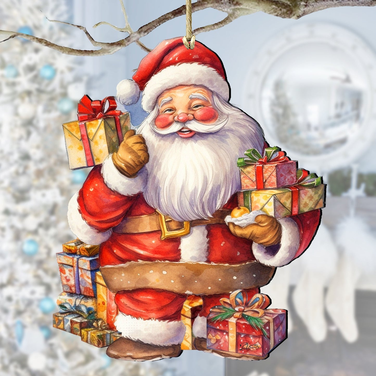 Decorative ornament of Santa Claus holding gifts against a blurred snowy background