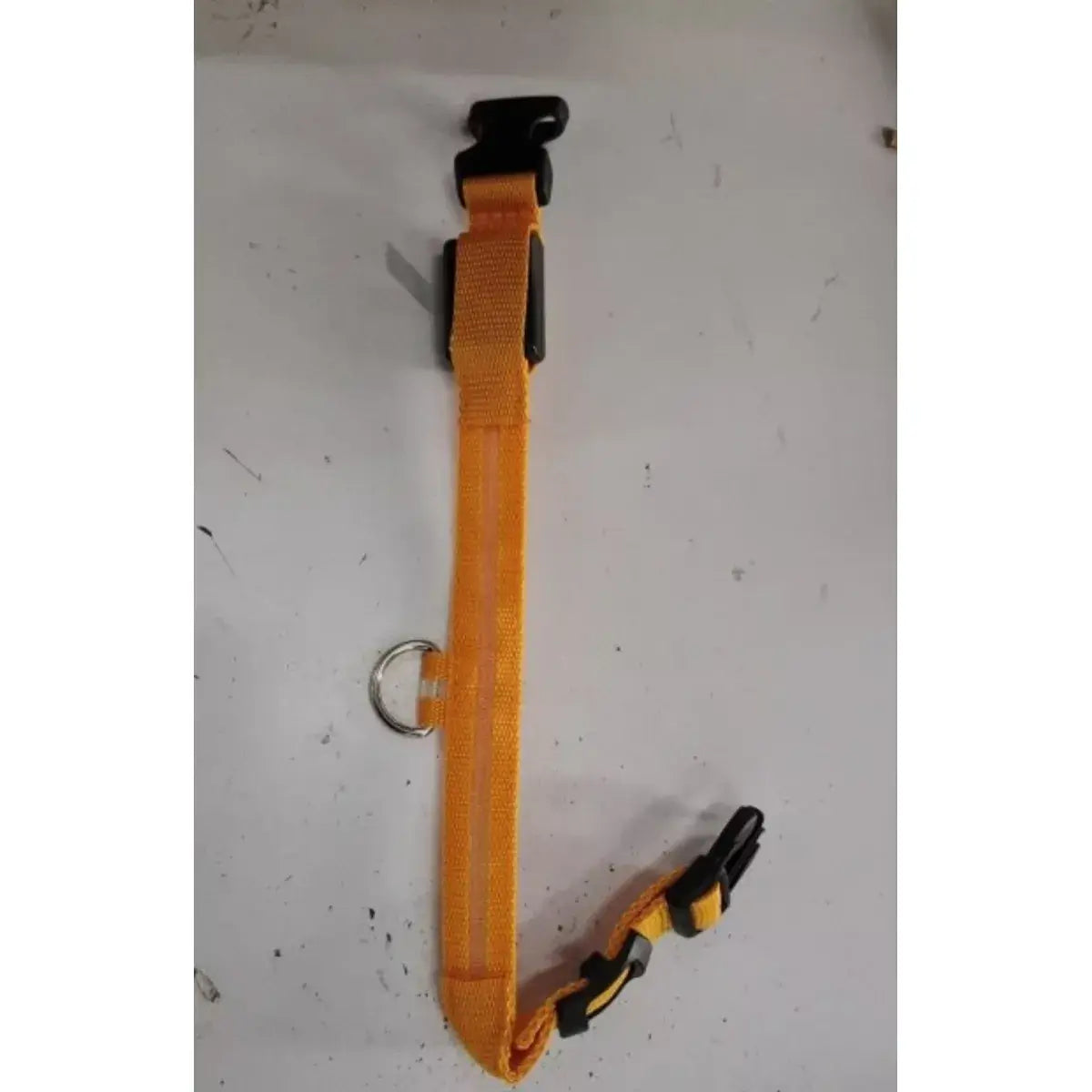 Orange strap with black clip on a white background
