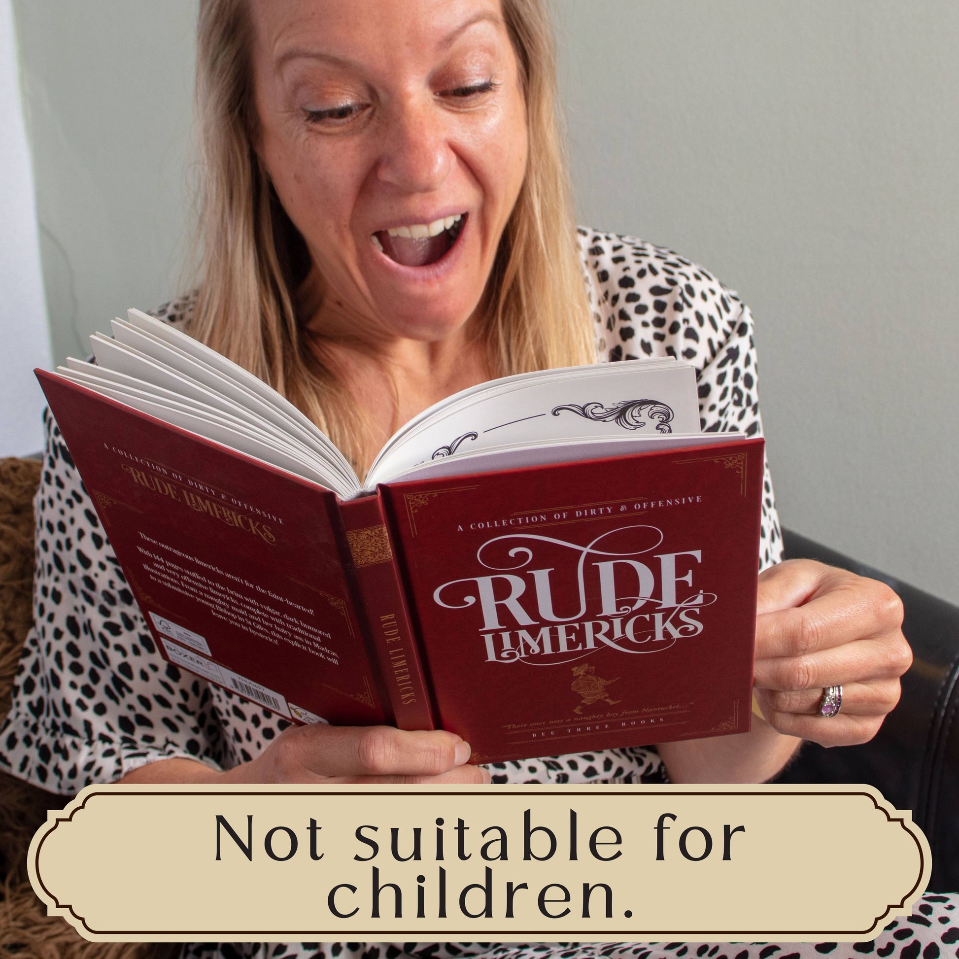 Woman reading a book titled 'Rude Limericks' with a label indicating it's not suitable for children.