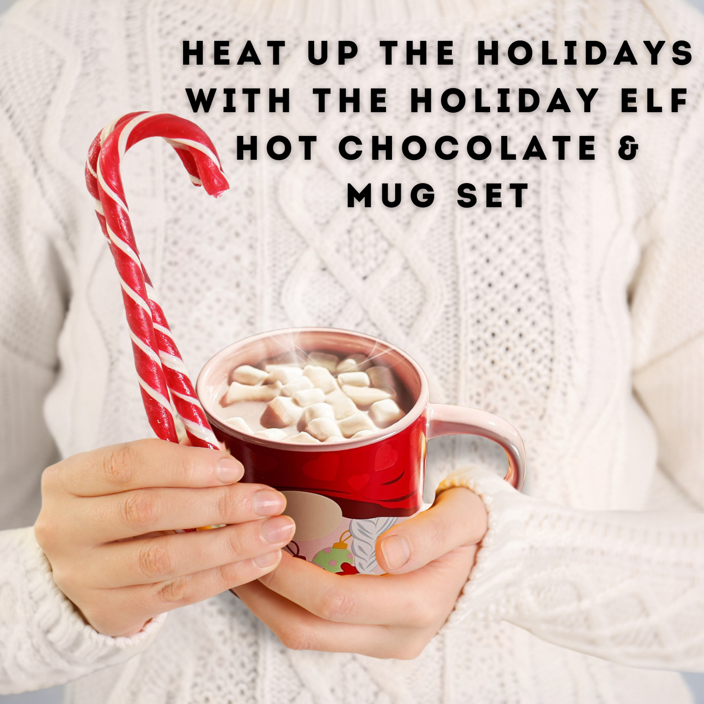 Person holding a red mug with hot chocolate and a candy cane, wearing a white sweater.