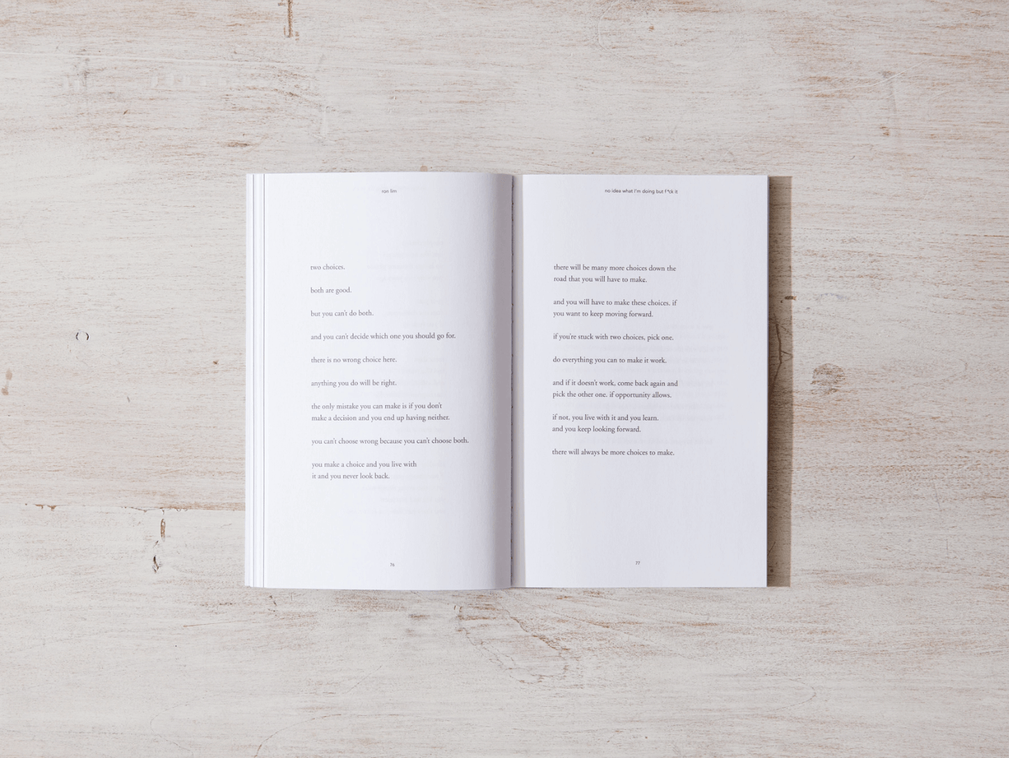 Open book on a light wooden surface