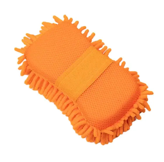 Orange scrubber with bristle texture on a white background