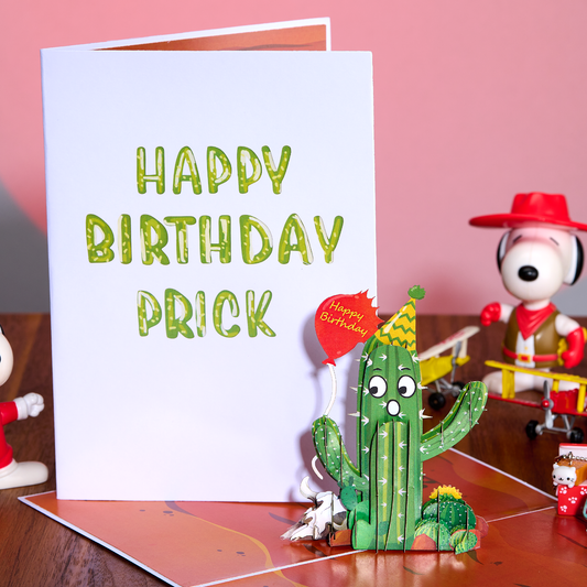 Birthday card with a cactus decoration and a character in the background