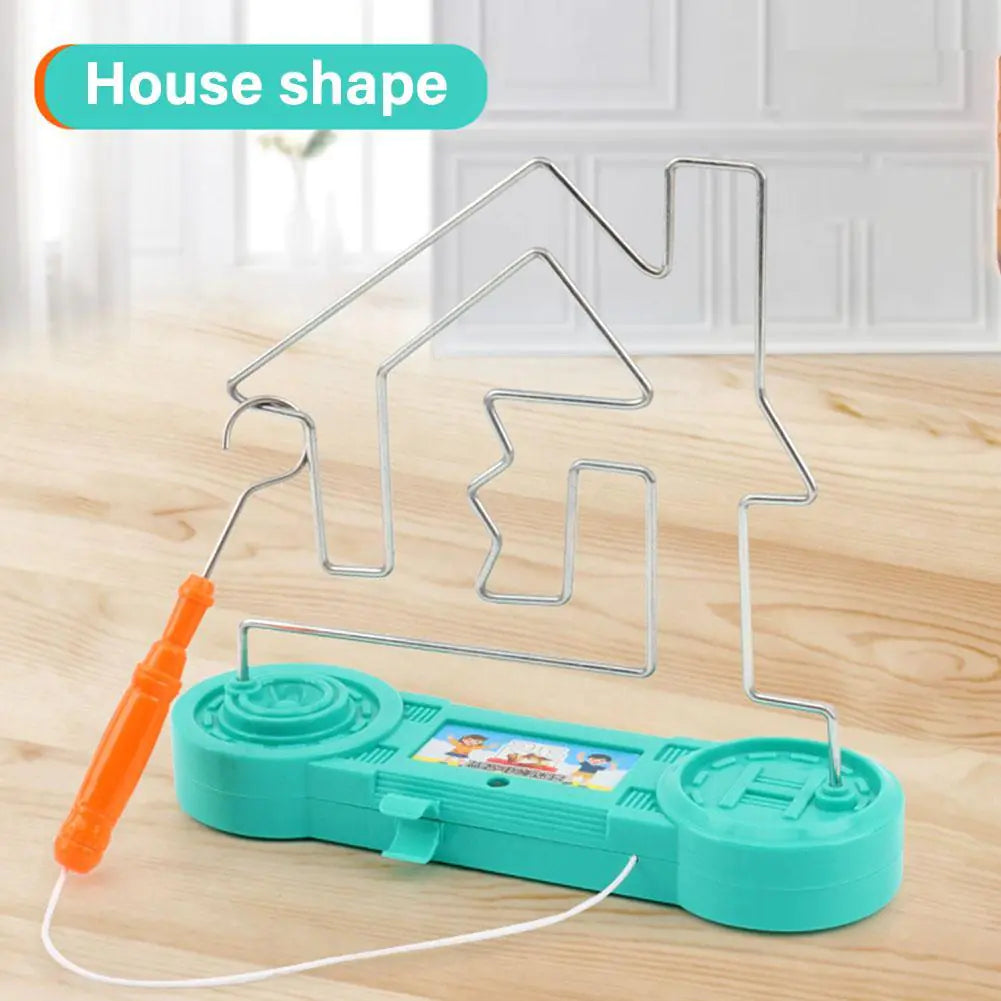 Paint roller with house-shaped handle on a wooden surface