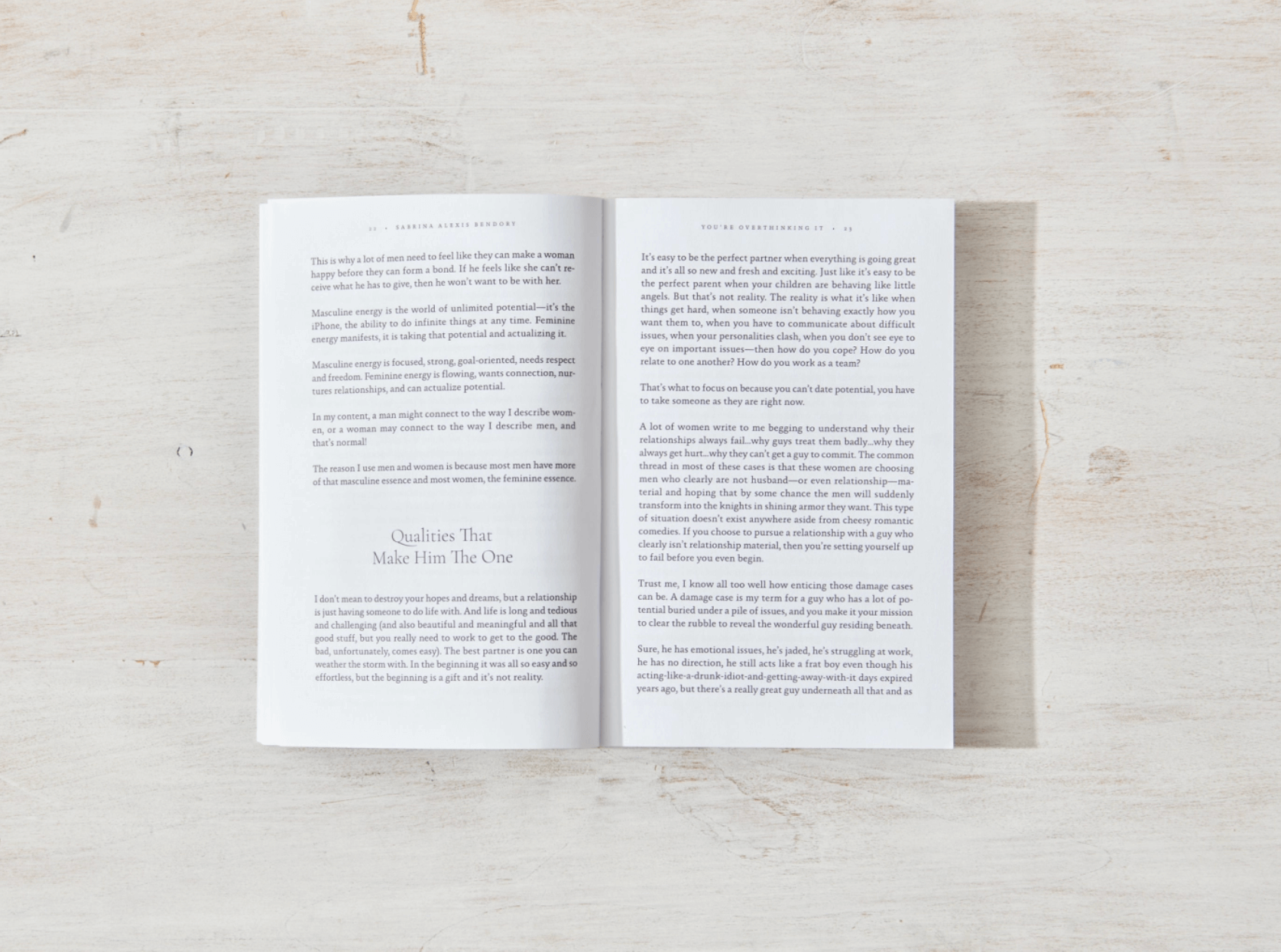 Open book on a light wooden surface