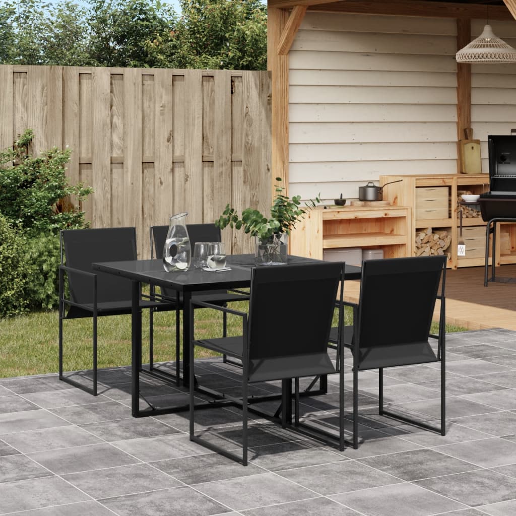 Outdoor patio set with black table and chairs on a tiled patio.