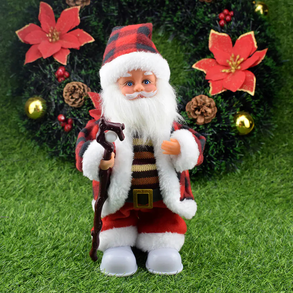Santa Claus figurine with a plaid hat and red outfit standing on grass with Christmas decorations in the background.