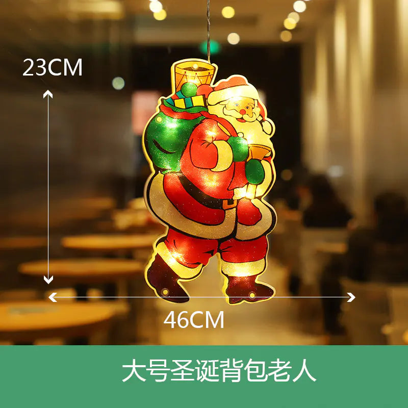 Decorative light-up Santa Claus figure with measurements on a blurred indoor background