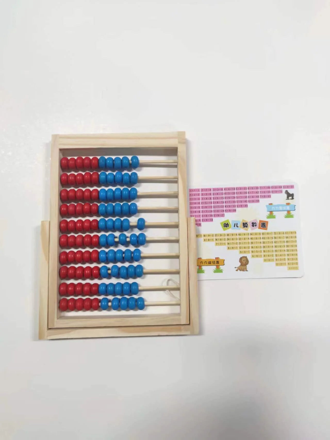 Wooden abacus with red and blue beads on a white background