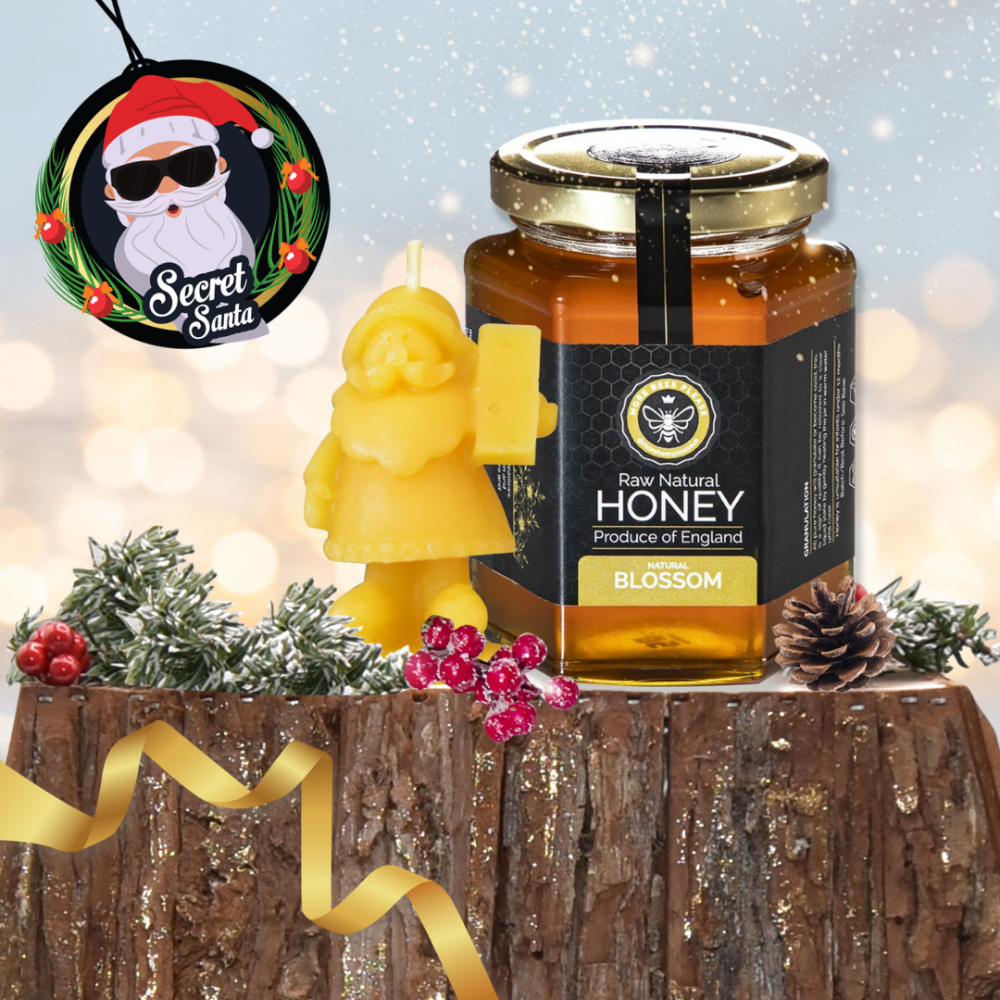 Jar of honey with a decorative label on a wooden surface with festive elements.