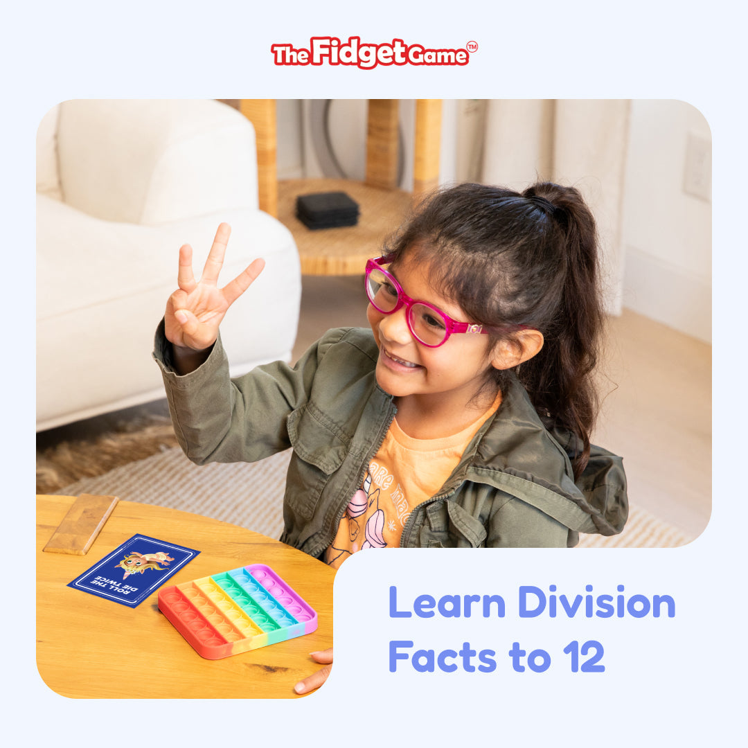 Child playing with educational game 'The Fidget Game' to learn division facts, sitting on a couch.