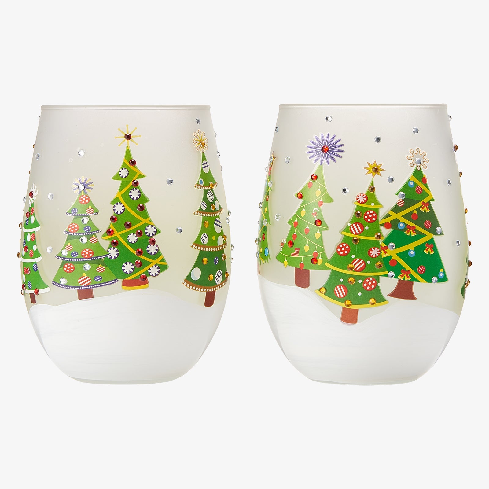 Two stemless wine glasses with Christmas tree designs on a white background
