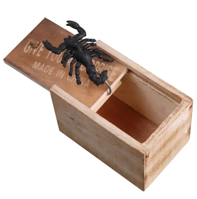 Wooden box with a black scorpion decoration on a white background