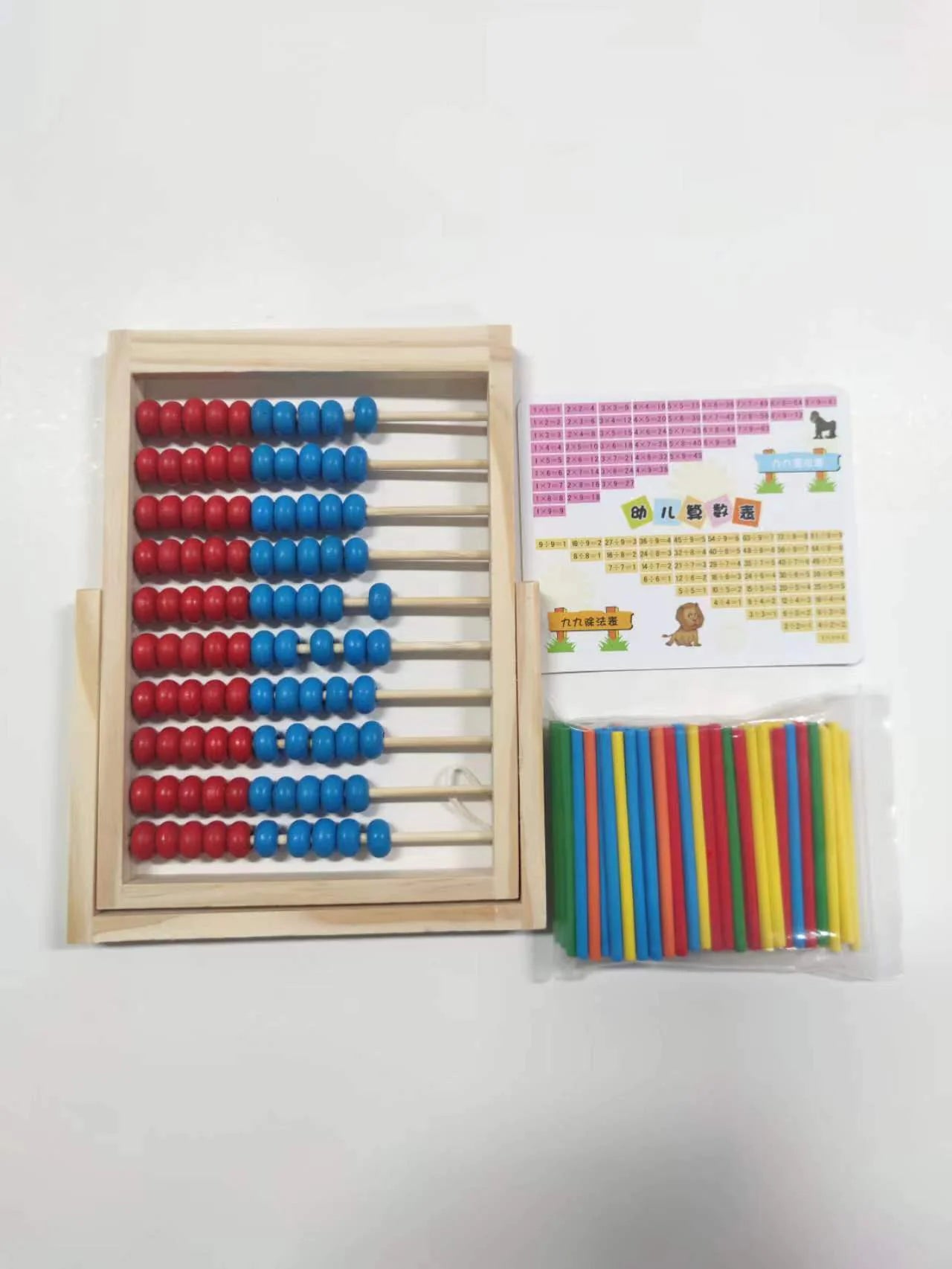 Set of colorful wooden counting sticks and abacus on a white background