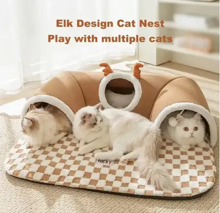 Cat nest with elk design featuring multiple cats inside on a checkered mat.
