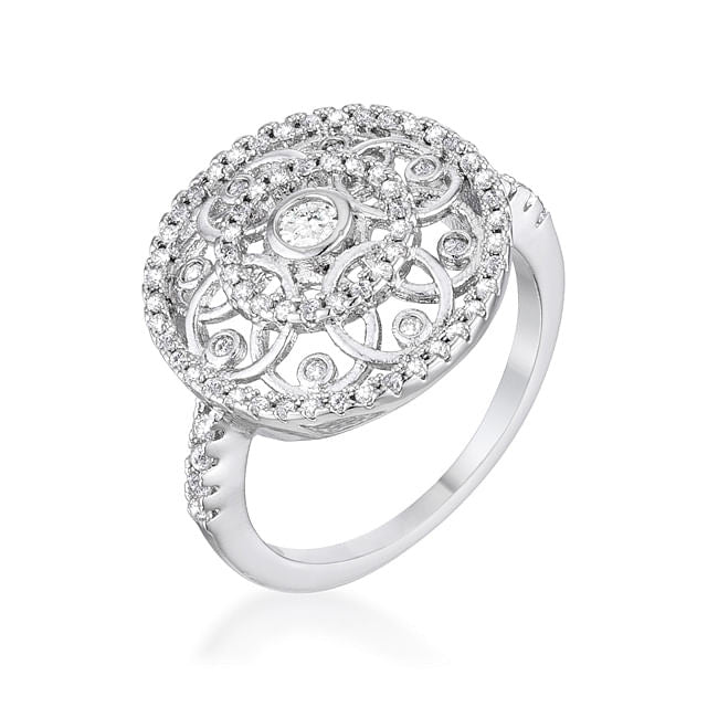 Silver ring with intricate design on a wooden surface