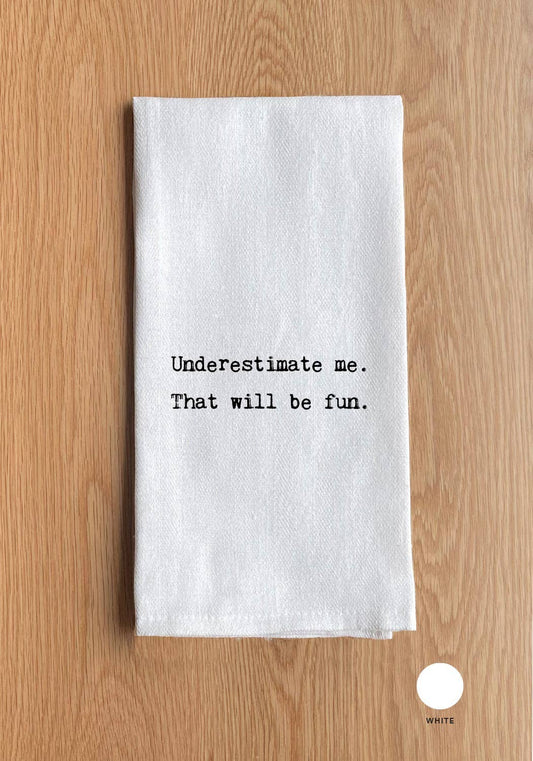 White towel with black text on a wooden surface