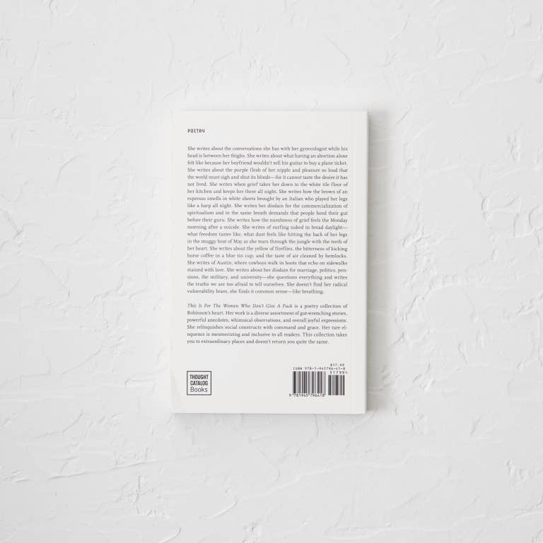 Back cover of a book with text and a barcode on a textured white surface