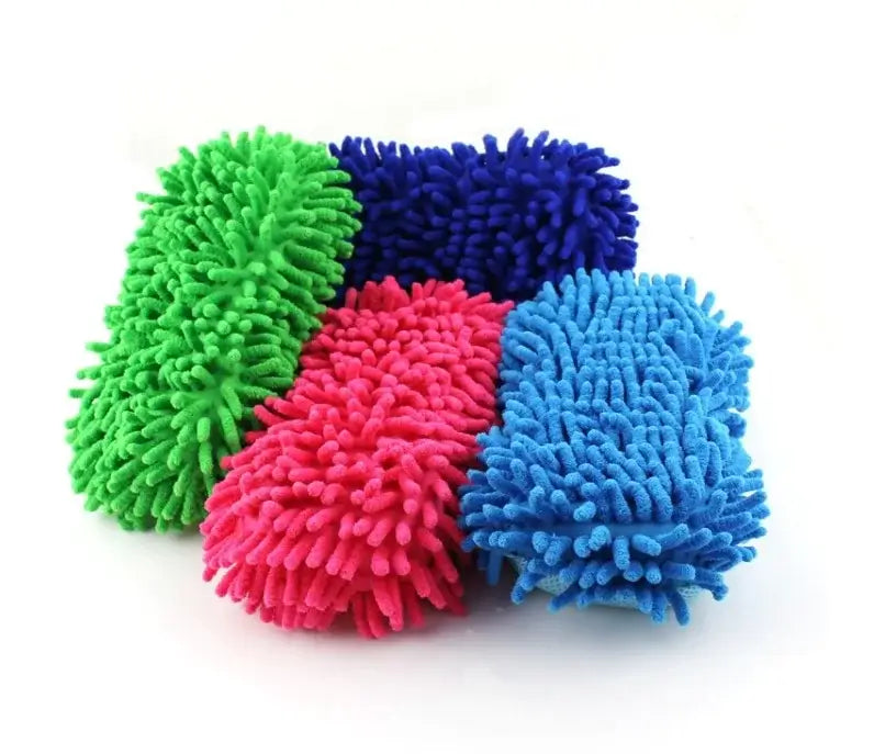 Four colorful microfiber cleaning pads in green, blue, pink, and purple on a white background.