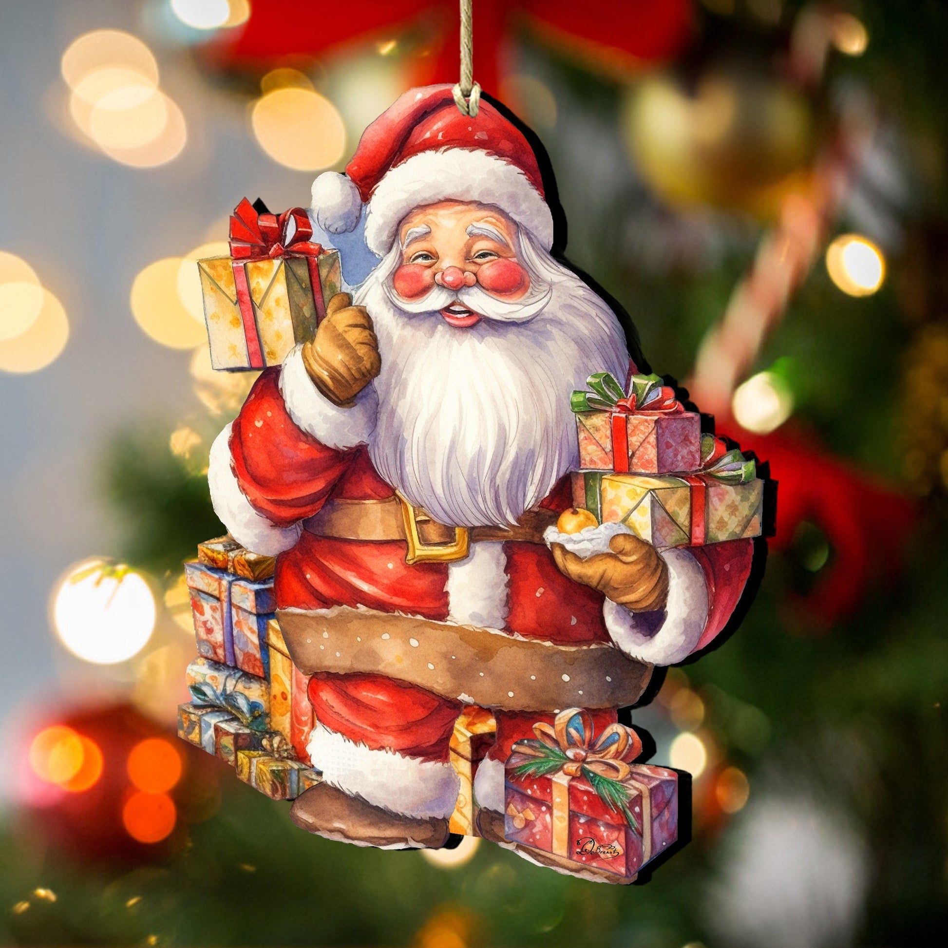 Decorative Christmas ornament of Santa Claus holding gifts with a blurred festive background.