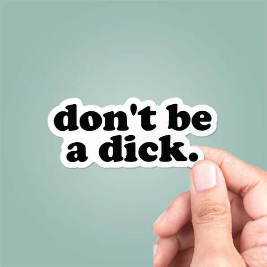 Hand holding a sticker with 'don't be a dick.' text on a light green background