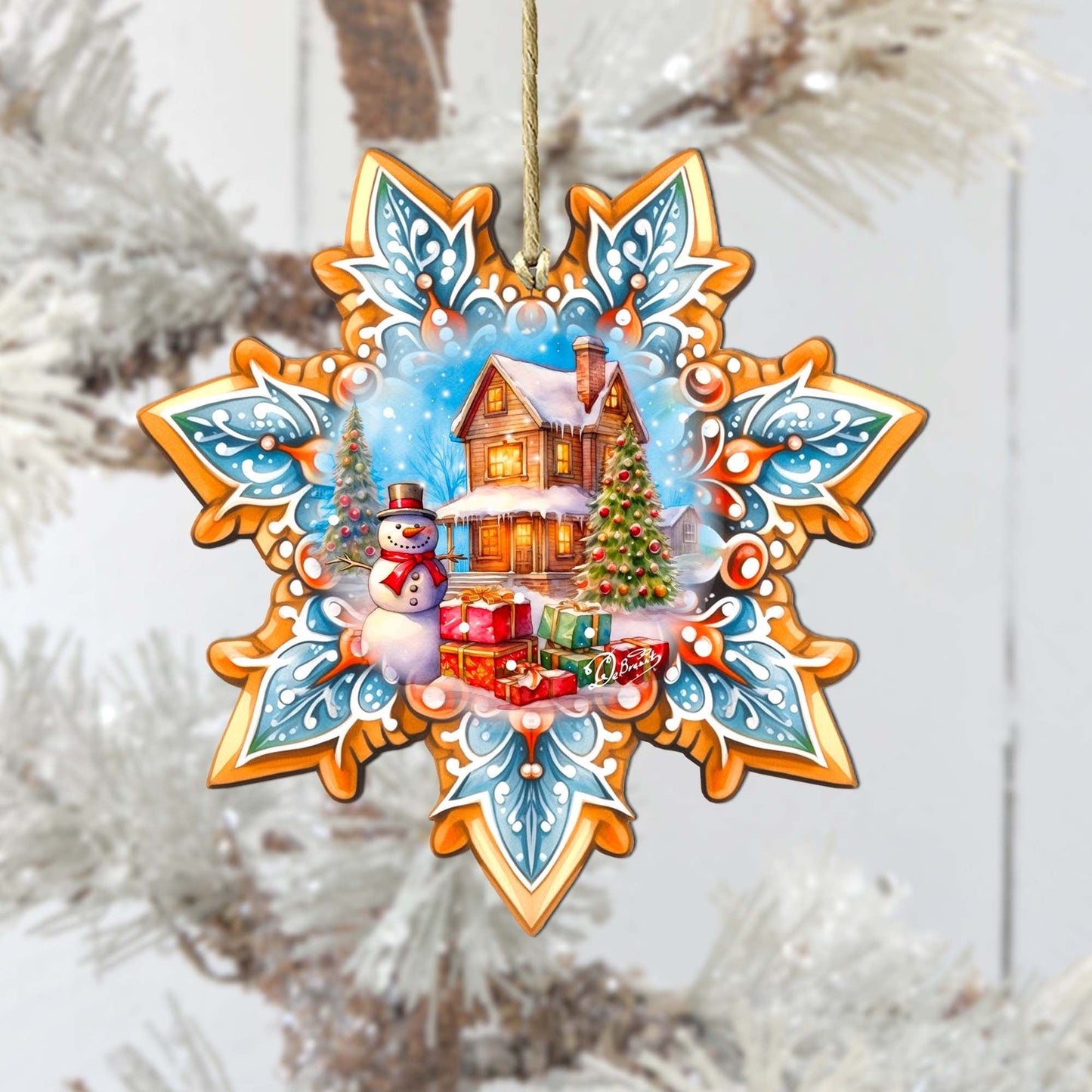 Decorative Christmas ornament with a snowman, house, and tree on a decorative background