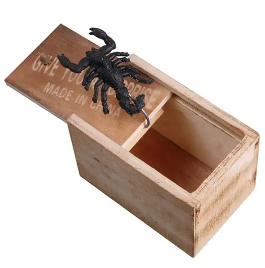 Wooden box with a black scorpion decoration on a white background