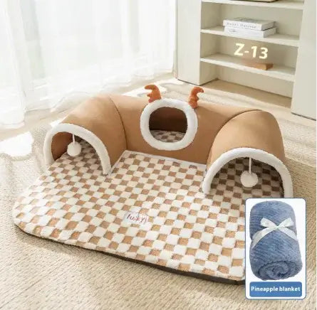 Pet bed with checkered blanket and small toy on a light wooden floor.
