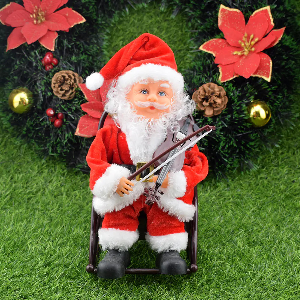 Santa Claus figurine playing a violin with Christmas decorations in the background